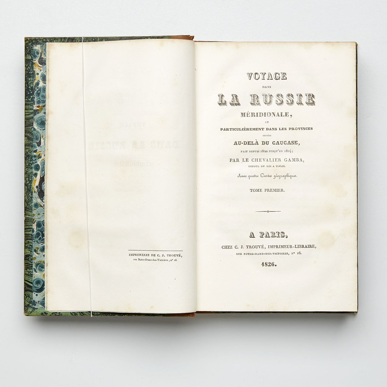 Voyage dans la Russie Méridionale, et particulièrement dans les provinces situées au-delà du Caucase, fait depuis 1820 jusqu`en 1824; Volume I-II in 8vo + Atlas in Folio (331 x 252 mm). Paris, C. J. Trouvé, 1826. Text volumes : (4) + IX + 444; (4) + 480 pp. 4 folding maps, one coloured in outline. 1 folding table. Text with occasional spotting. Atlas volume : 60 lithographic and engraved plates, of which 34 hand-coloured, one plate foxed and with tear. Uniformily bound in contemporary half calf. Gilt spines. Upper joints partly cracked. Bookplate (Gösta Nobel). Stamp with barionial crown and monogram G S on first fly-leafs. Complete, with the rare atlas volume. - Bilde 2